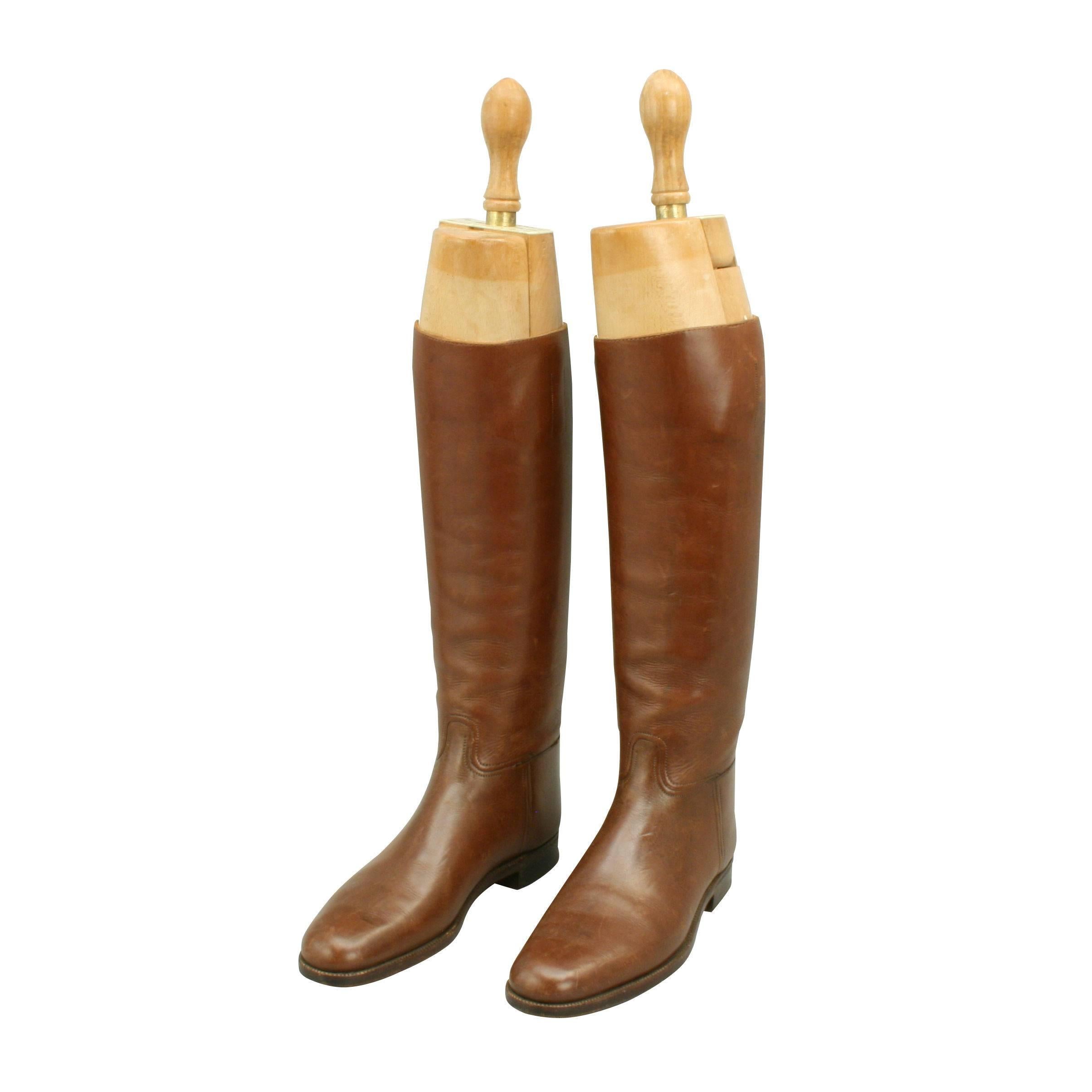 Vintage pair of Peal & Co. brown leather riding boots.
A very good pair of tan leather boots with beech wood trees. The boots are made in England by Peal & Co, 487 Oxford Street, London. Marked in ink under the embossed manufactures details inside