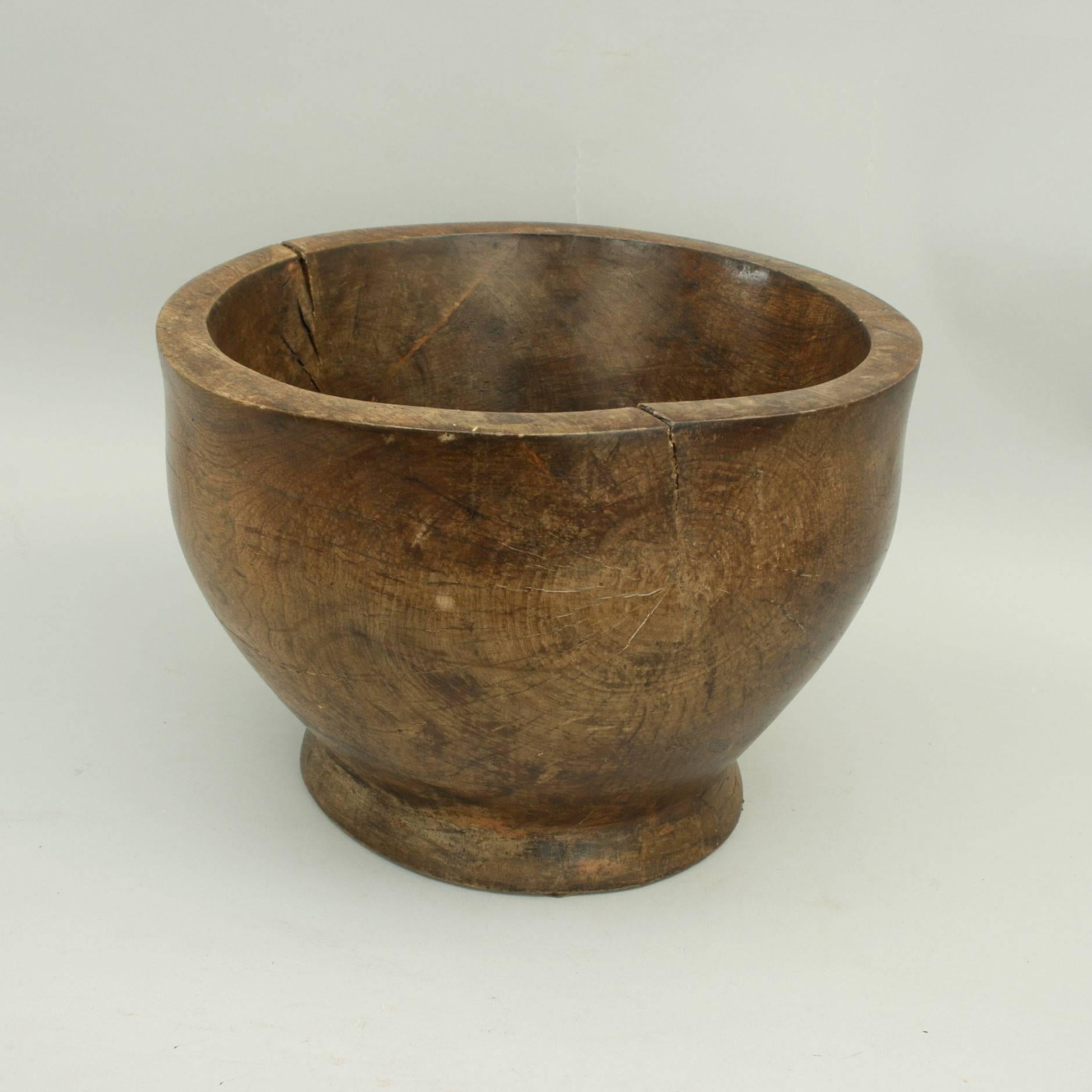 A good size bowl, probably turned from walnut or teak. The bowl is very solid with thick walls and wonderful grain and very nice patina.