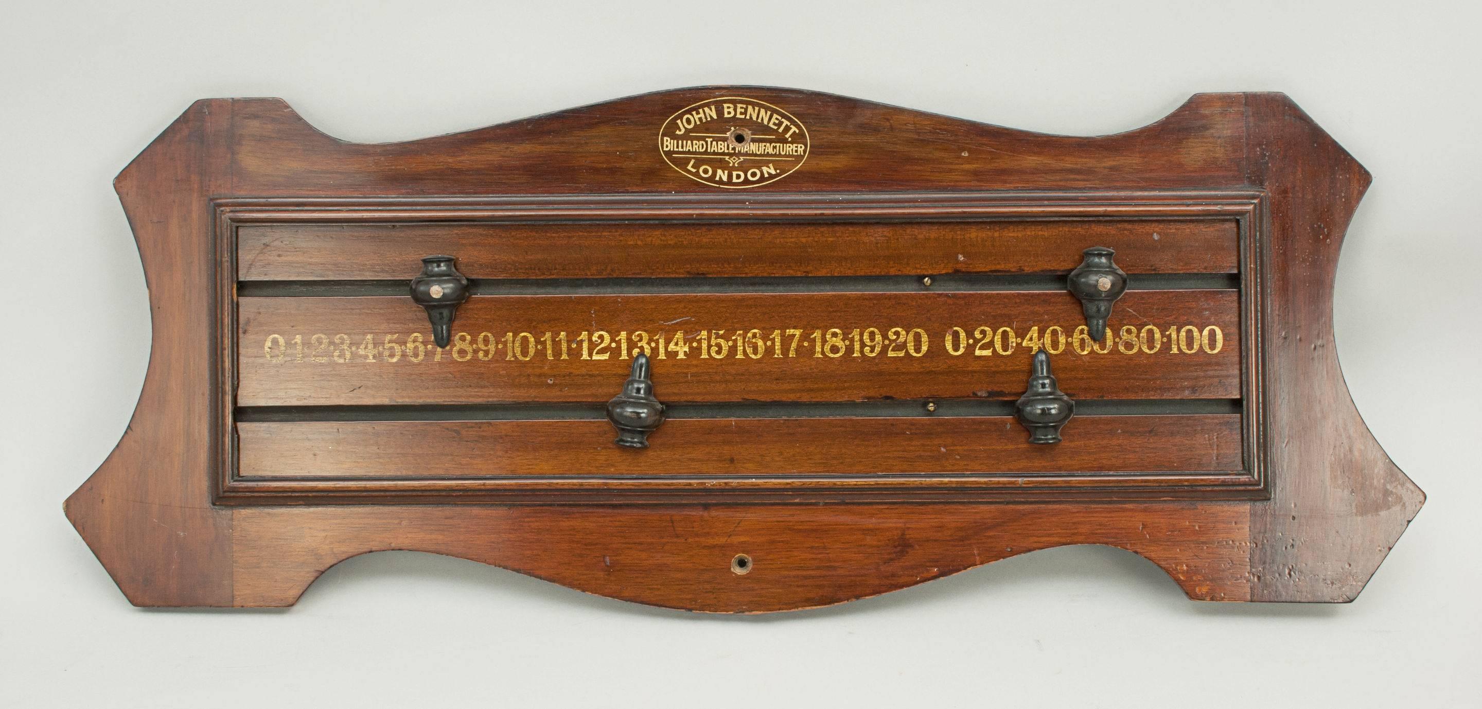 Mahogany score board.
A nice shaped billiard, snooker scoreboard by John Bennett, London. The scorer with wooden pointers, one set with spot. The numbers are 0 to 20 and 0 to 100 in multiples of 20.