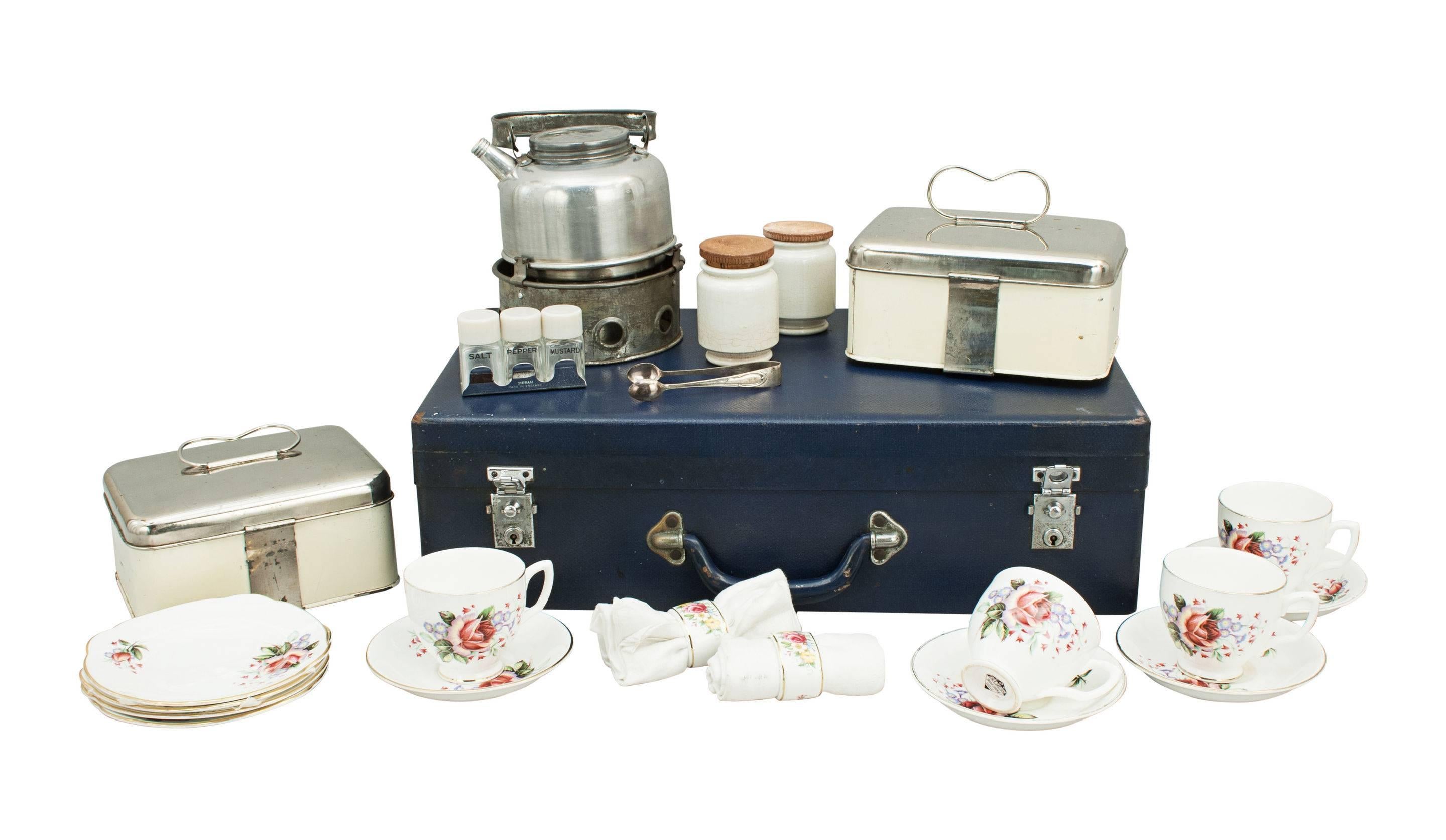 Vintage 'Sirram' picnic set.
A great mid-20th century four-person picnic set in a carry case. The case is covered in blue cloth with two nickel-plated locks and catches, the contents in a good neat compact setting, held in place in the lid by
