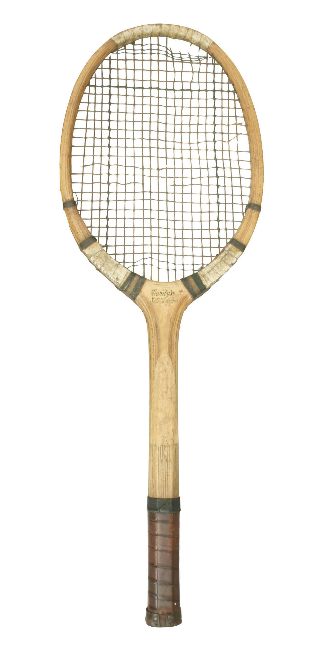 A rare split bamboo tennis racket by Hardy Bros. of Alnwick - the famous fishing tackle manufacturers. The leather grip probably added and some of the original strings broken.
A rare piece.