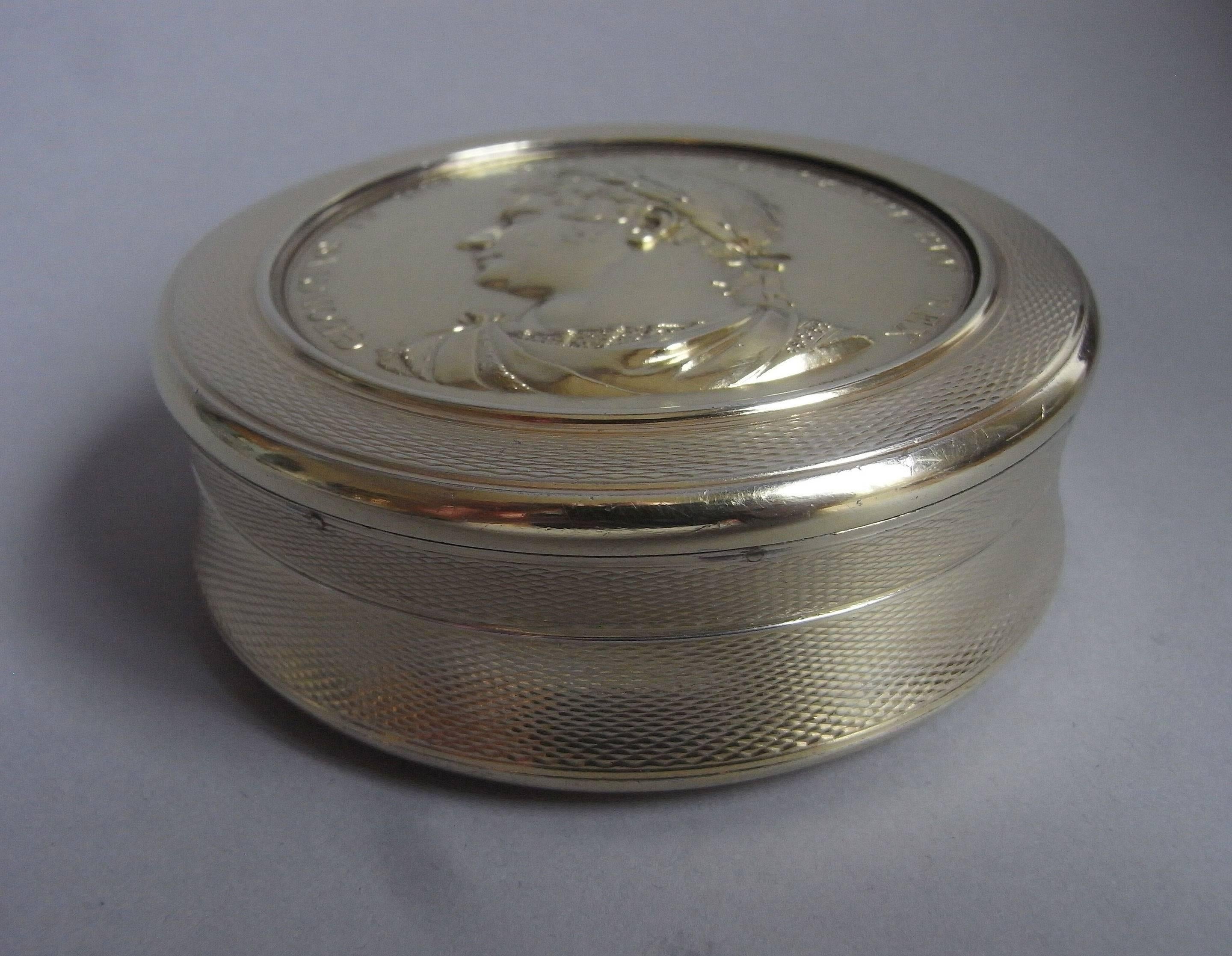 A highly important George IV silver gilt Coronation Box made in London in 1823 by the Royal Box maker, Alexander James Strachan.

The box has a deep circular form and is engraved with an engine turned frame on the cover and sides. The base is