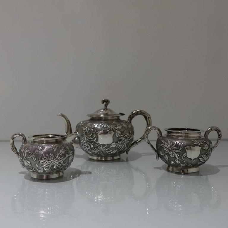 A stunning looking Chinese tea set floral embossed throughout which is then set on a matte background for contrast. The teapot lid is hinged with elegant floral engraving for highlights. All pieces have an applied silver shield for engraving.