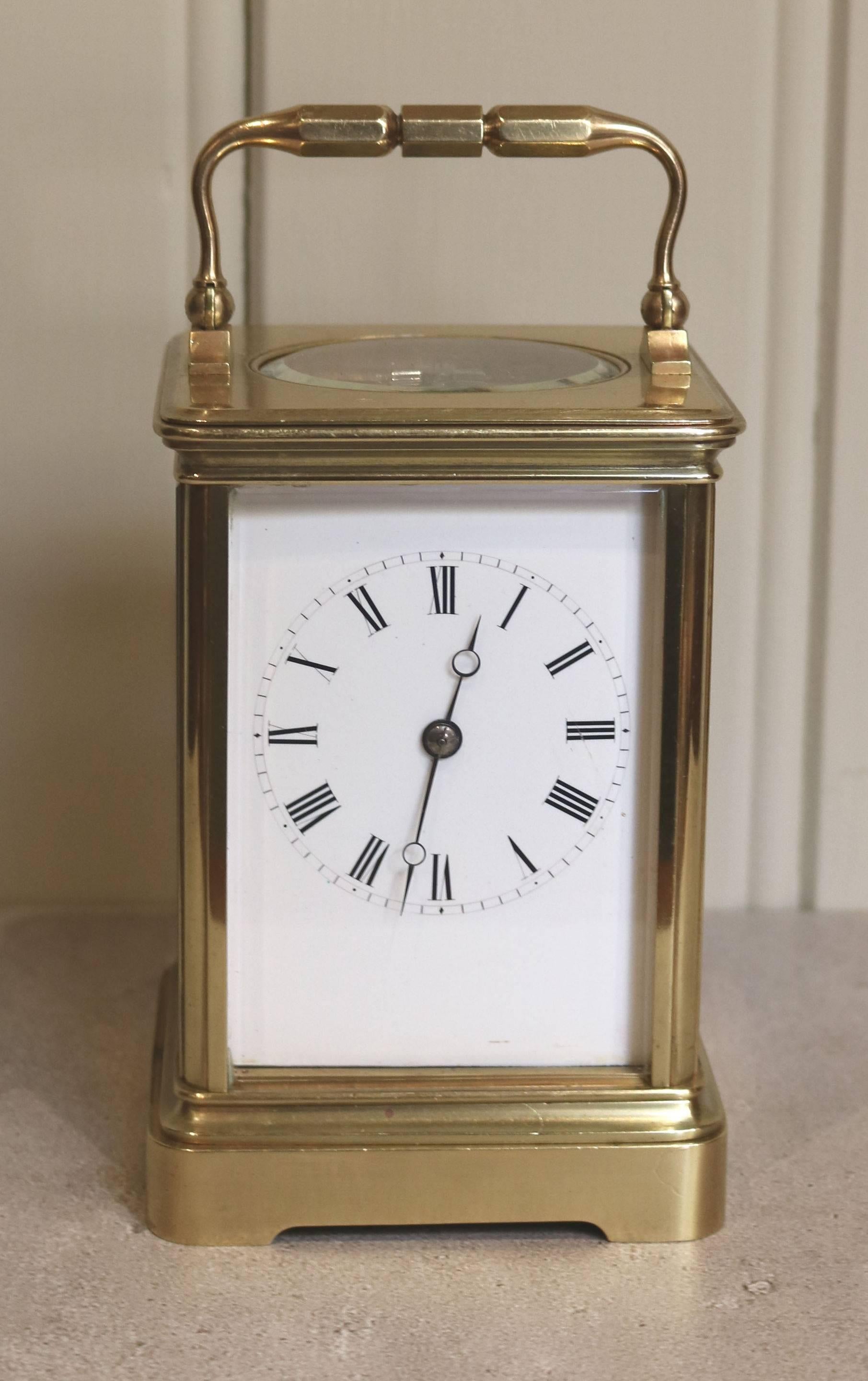 A high quality large timepiece carriage clock made by the renowned maker Drocourt. The corniche case has a large oval top window and bevel glass sides. Its enamel dial has Fine moon hands and the backplate is stamped with the makers logo and is