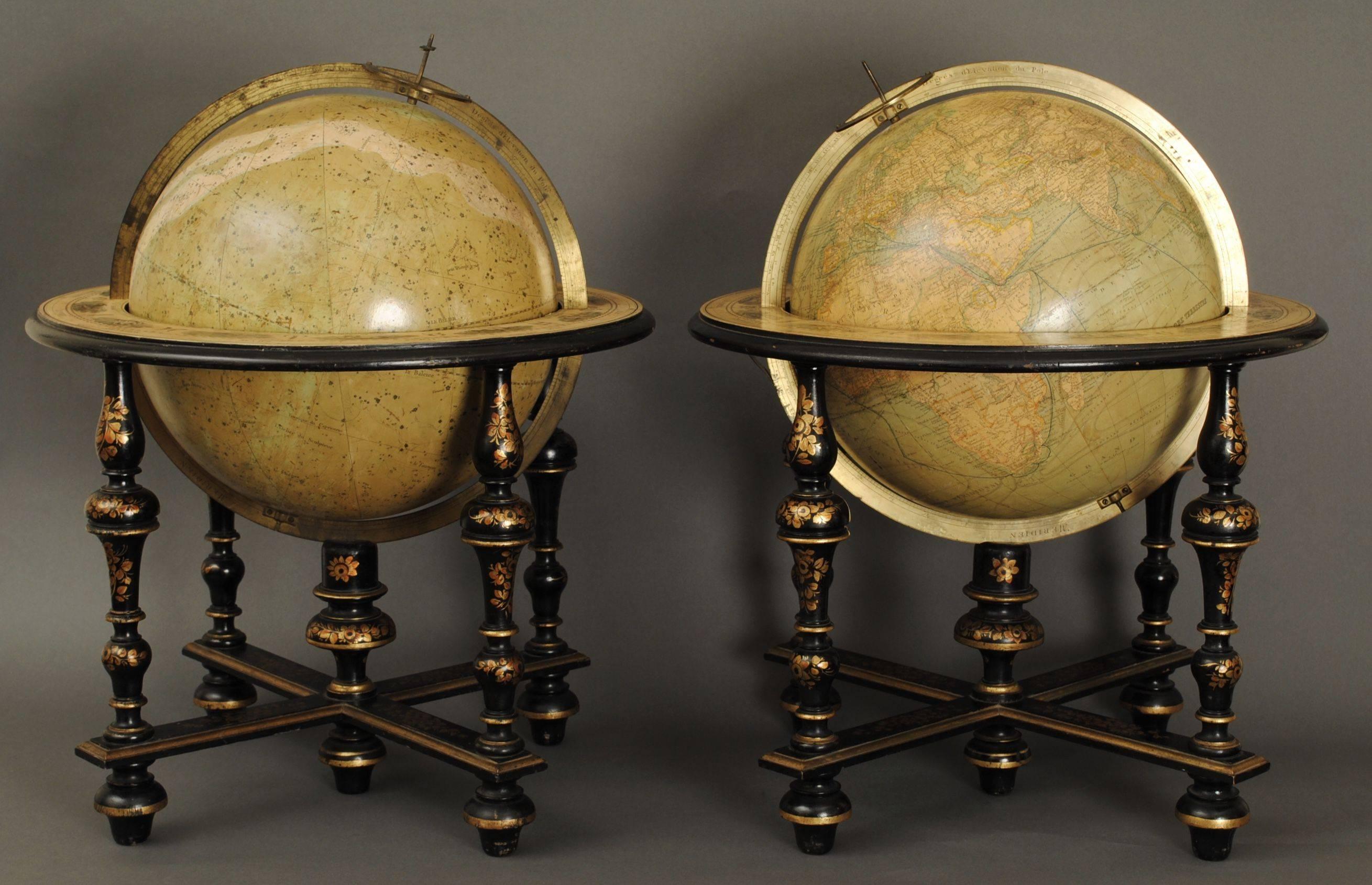 A wonderful pair of 19th century table globes by Mansion Delamarche Paris, in superb original condition. The 12" globes in the original lacquered and gilt decorated stands.