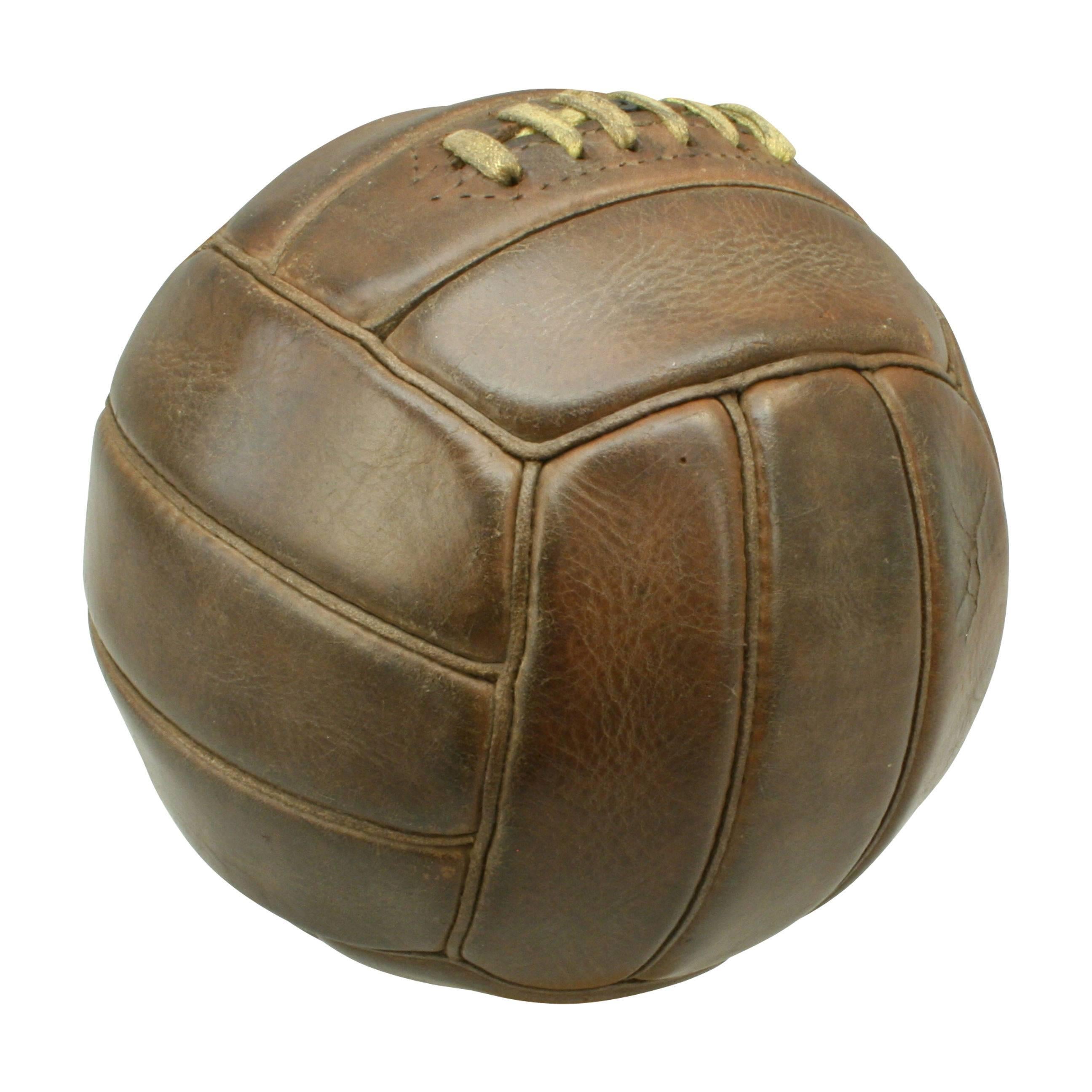 A traditional 18-panel dark brown leather netball ball in very good original condition and colour. The ball has a lace-up slit to the top to enable bladder inflation or replacement. The ball is very similar to a football except that the panels have