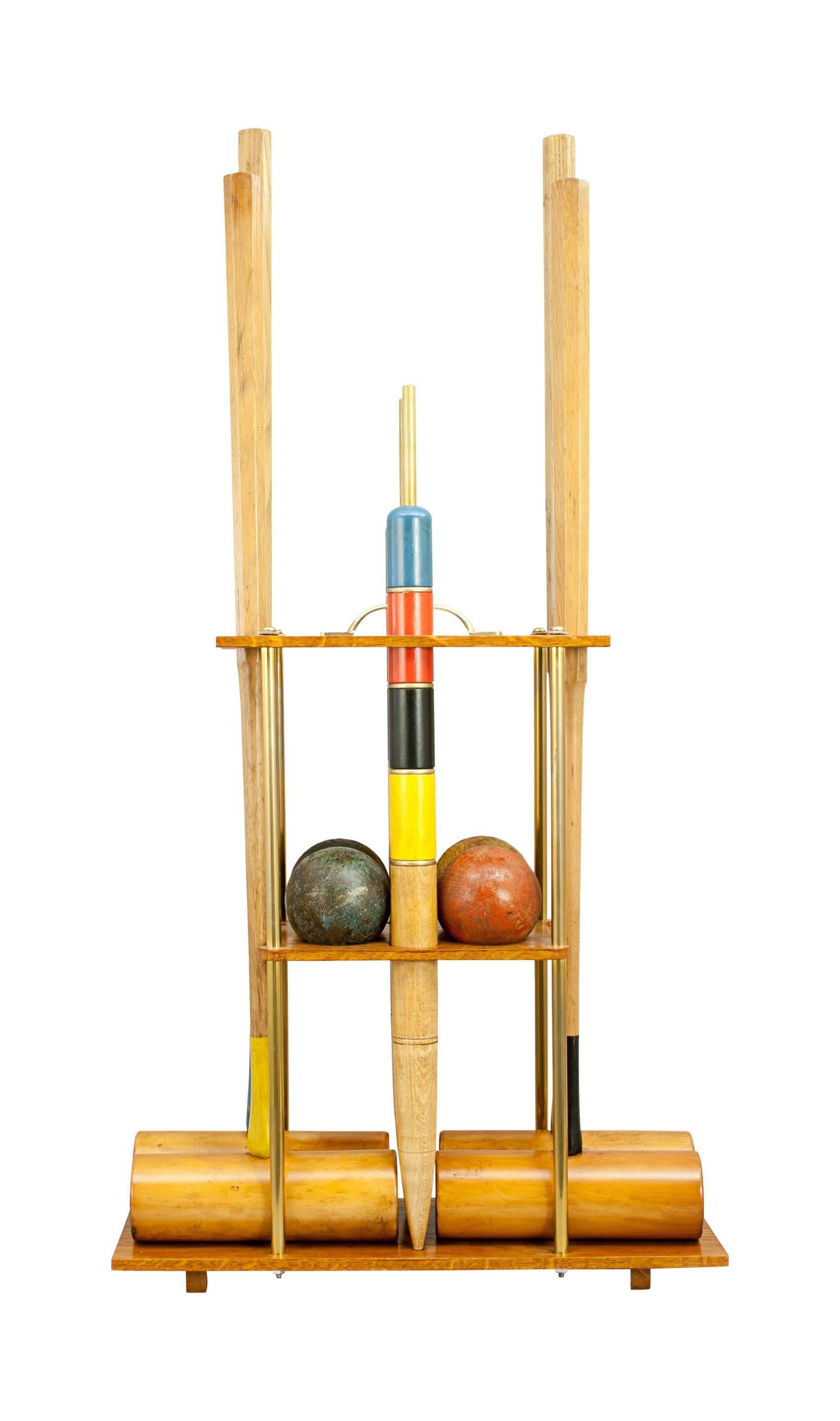 Vintage F.H. Ayres Croquet Set.
A high quality F.H. Ayres croquet set on a new oak carry stand. The set is with four boxwood croquet mallets. All mallets are with octagonal ash handles and marked 'F.H.Ayres'. To complete the set there are four