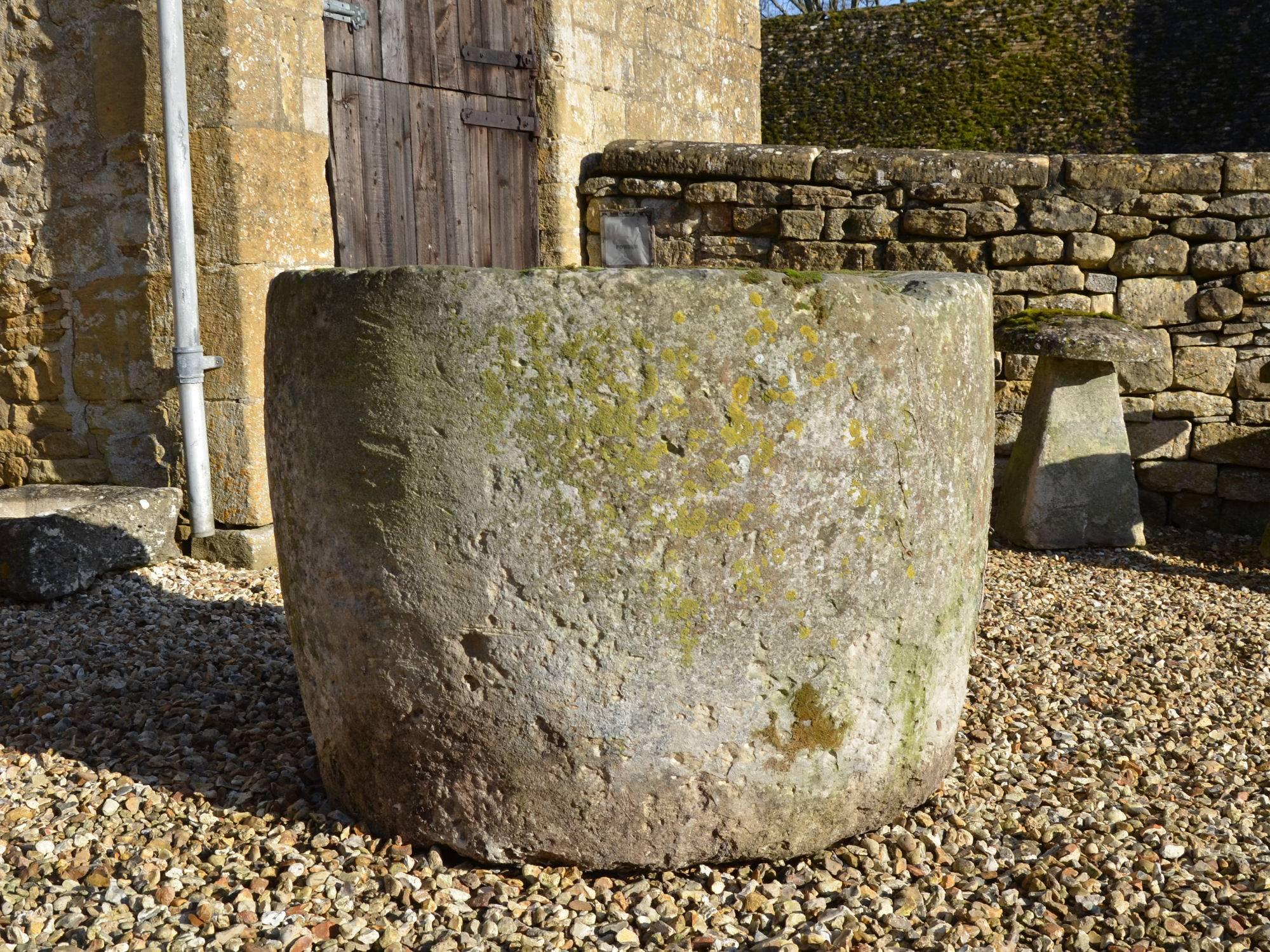 A large 18th century circular stone trough.