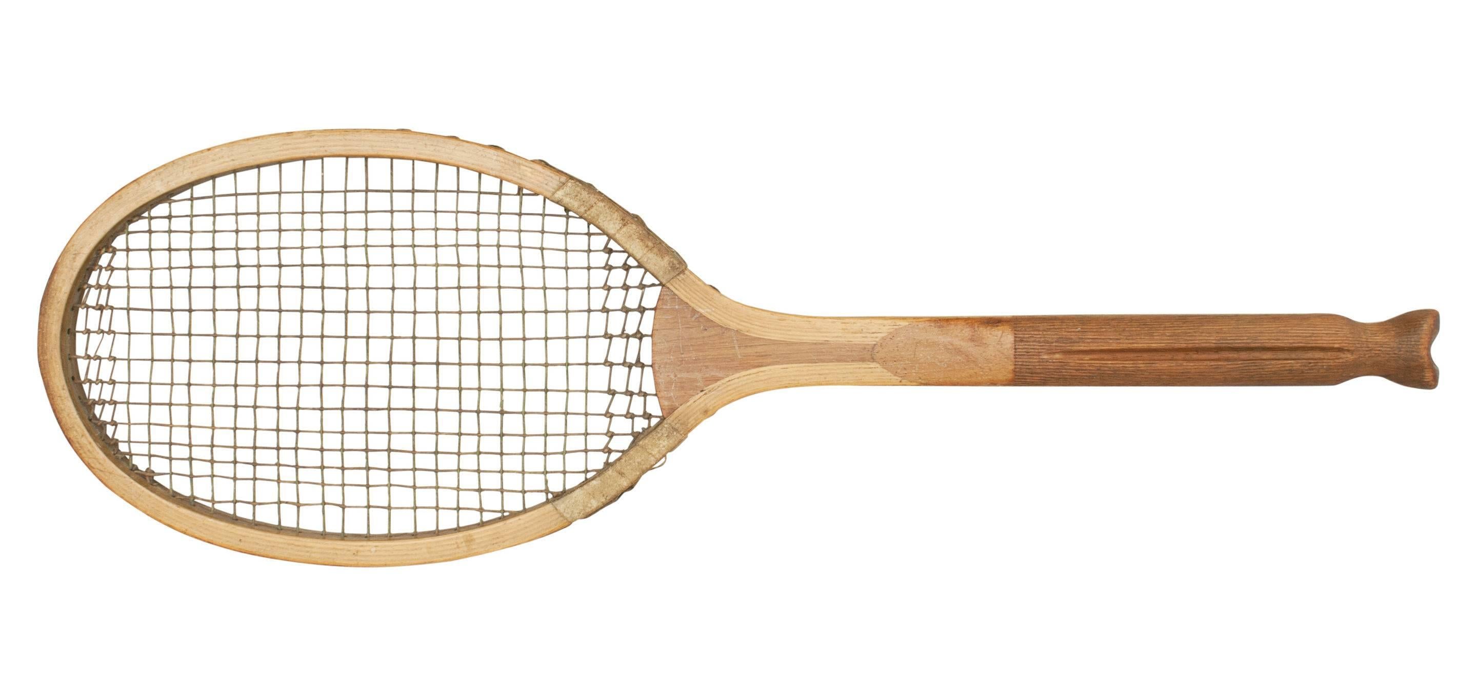 Antique Slazenger Fishtail Tennis Racket, The Demon.
A fine quality Demon fishtail lawn tennis racket by Slazenger & Sons, the frame in good condition with good markings. The horizontal strings are all original, the vertical ones have been replaced.