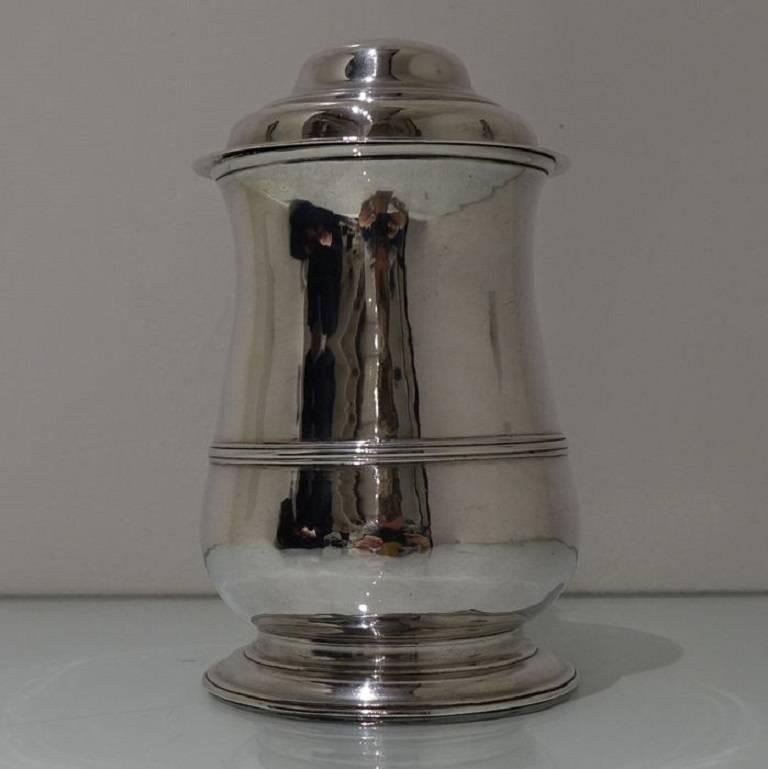 A very elegant and extremely good quality baluster tankard with hinged lid. The tankard is plain formed and has a stylish girdle to the lower section of the body for highlights. There is a decorative wire thumb piece for easy use