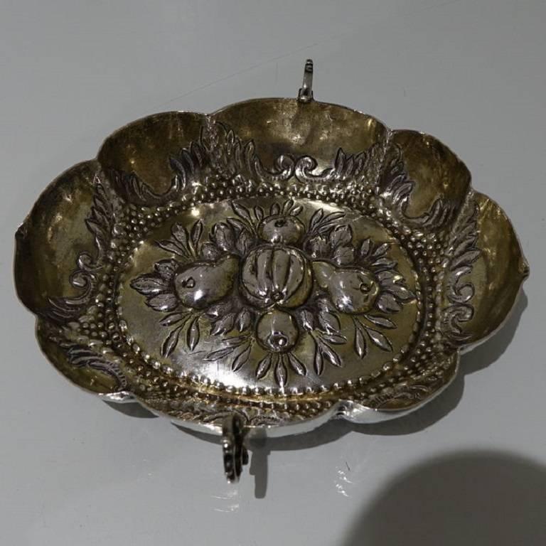 A highly collectable 17th century German partial gilt wine taster, the body is panelled in design with elegant flat chasing on the inner walls. The base has a stylish central grape and vine theme which is surrounded by a elegant bead gallery. 
The