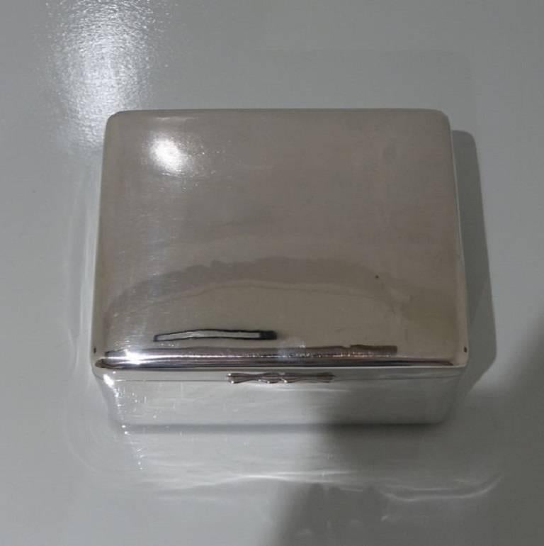 A beautiful mid sized plain formed antique silver cigar/cigarette box with hinged lid and inner wood panelling. 
The length is 15.2 cm (6 inches).