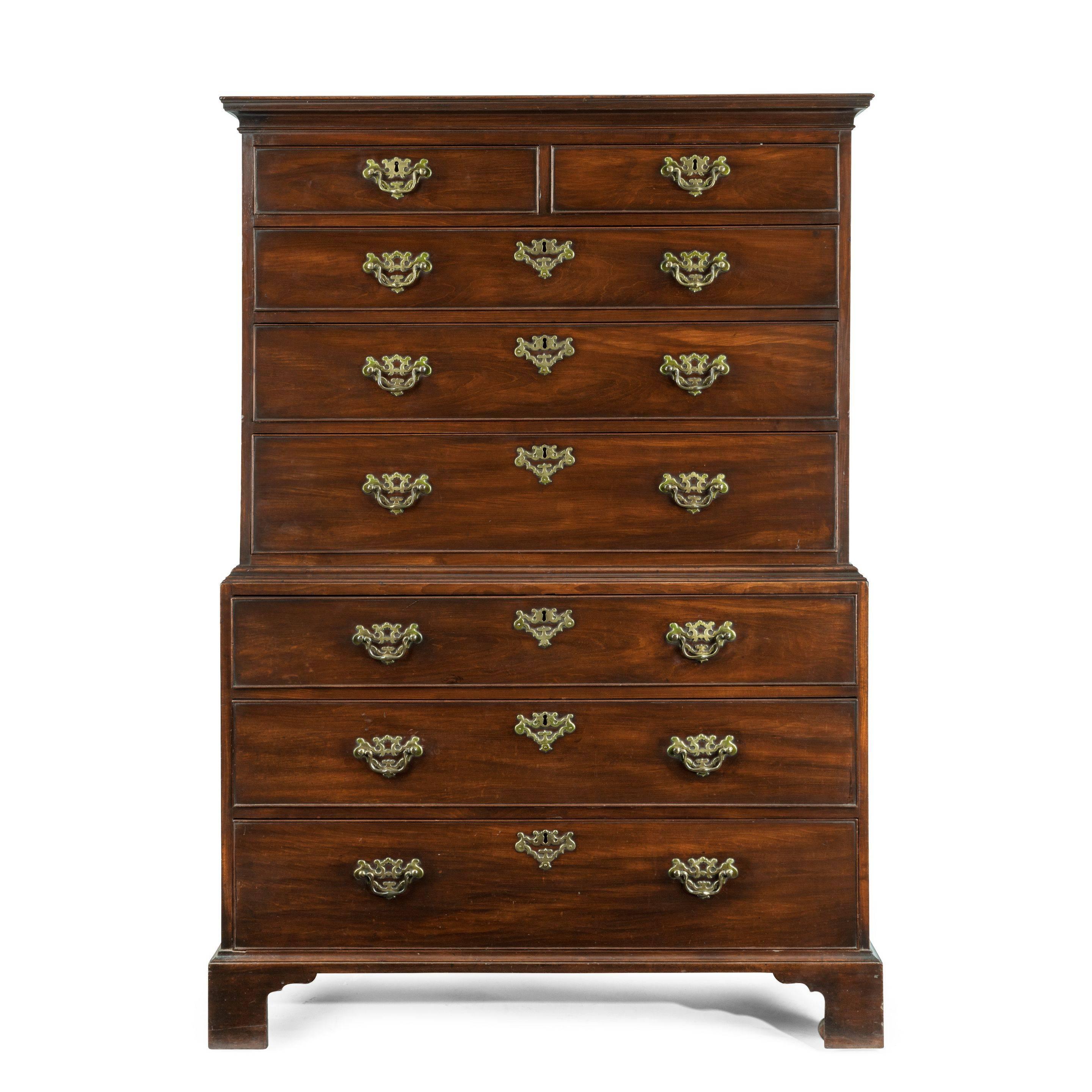 A George II mahogany tallboy, of beautiful patina and originality. It is of rectangular form with two short and three long drawers above three further drawers, with the original handles, the mahogany laid on oak, original castors, English, circa