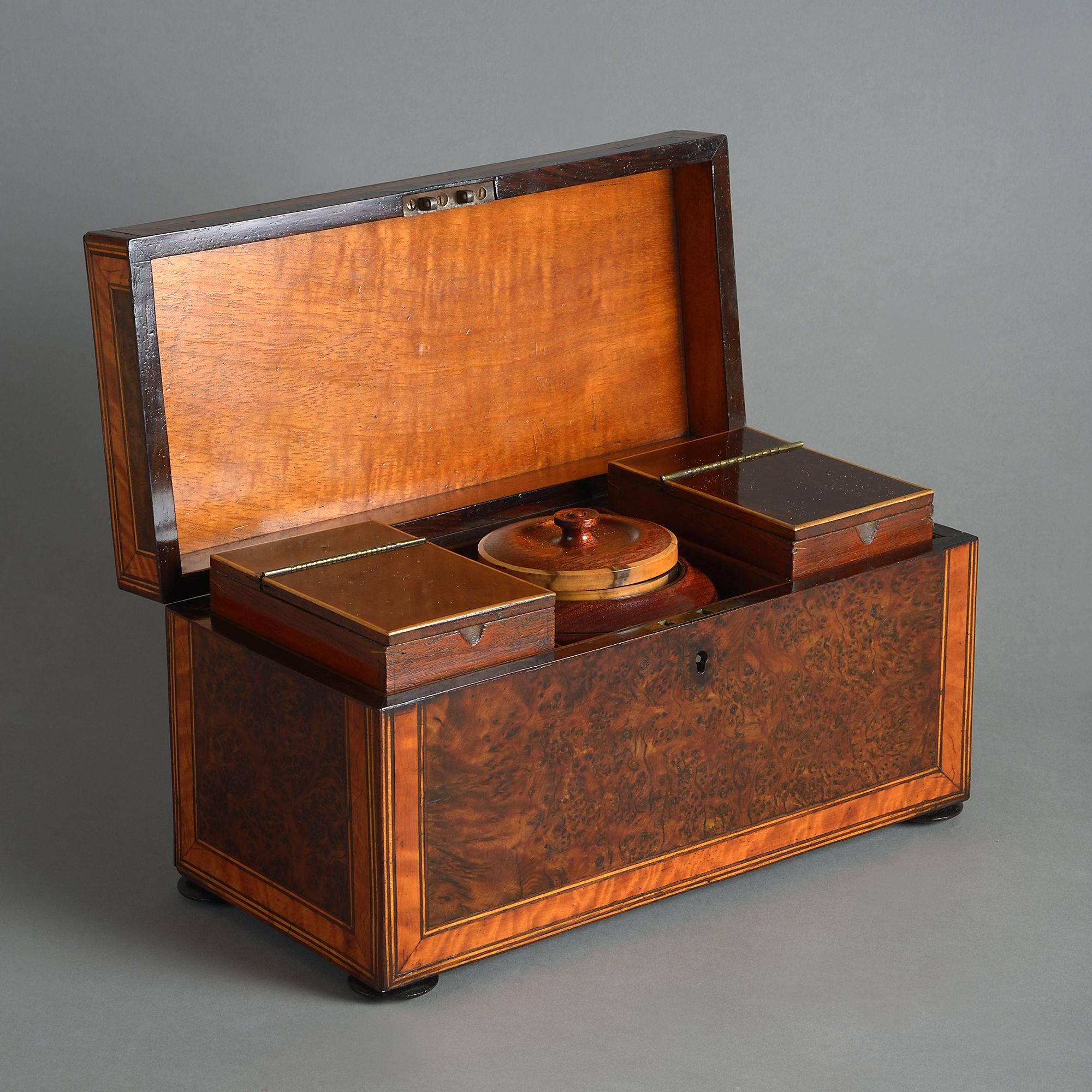 A George III Period burr elm and satinwood veneered tea caddy, retaining its original compartments and mixing bowl.