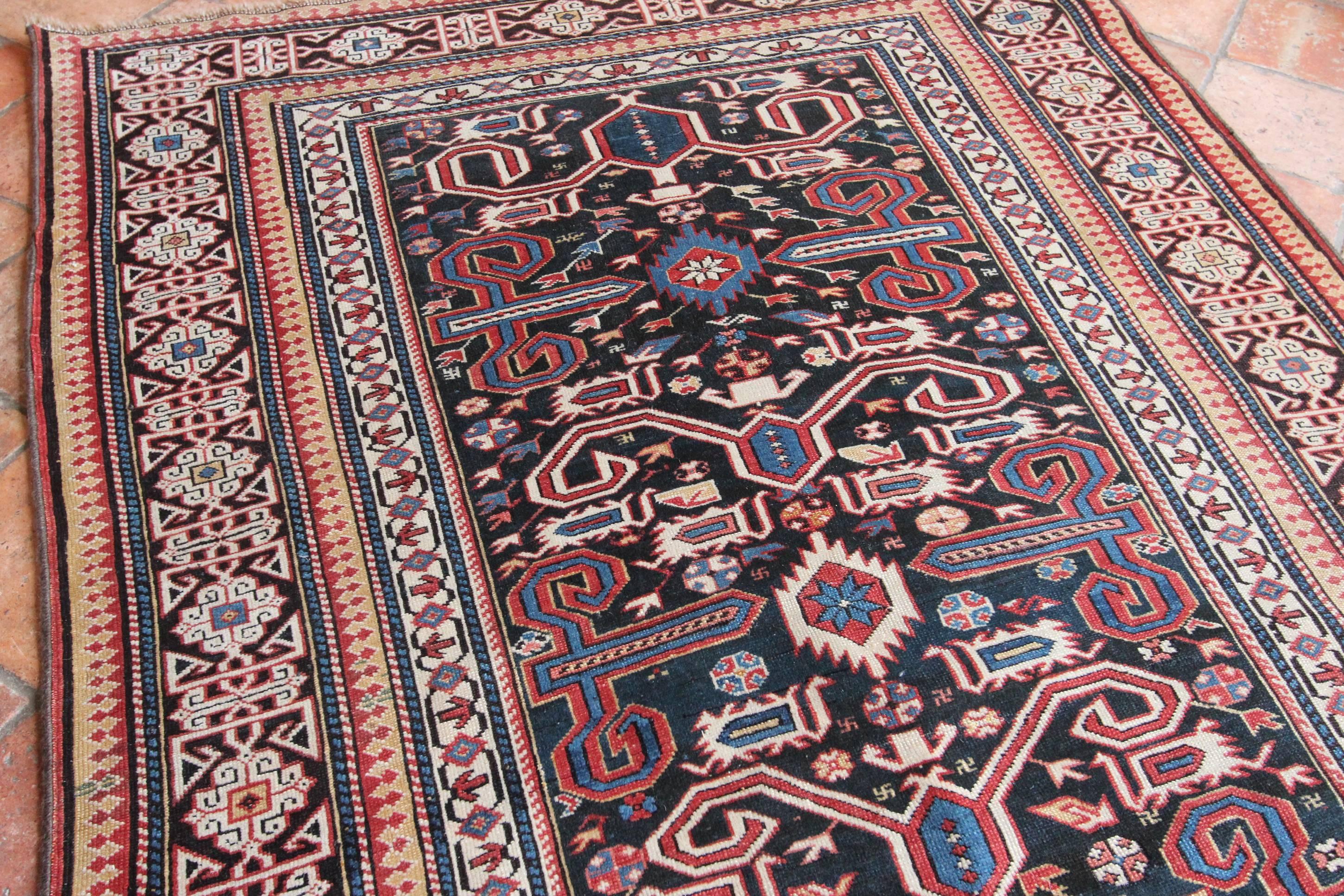 A stunning antique Perepedil rug in excellent original condition. Caucasian rugs are usually geometric in design and this type of rug is no exception. Perepedil rugs have an easily recognisable ‘rams’ horn design in the main field, on this occasion
