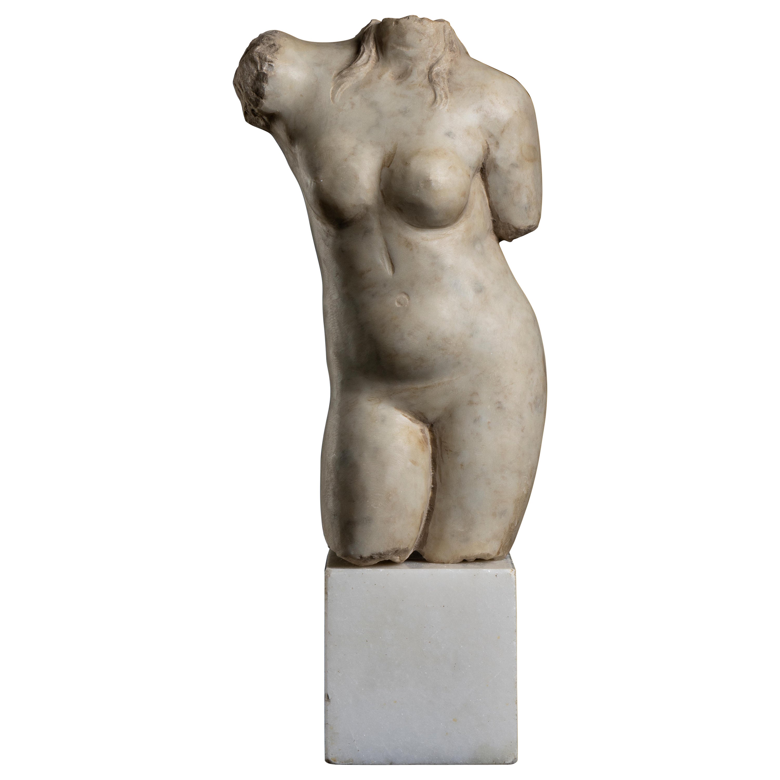 an interesting and elegant white statuary aged marble torso sculpture of a goddess, standing on a white marble squared plinth in ground style carved probably in Rome in the first half or quarter of the 20th century.
Two locks of hair fell on the