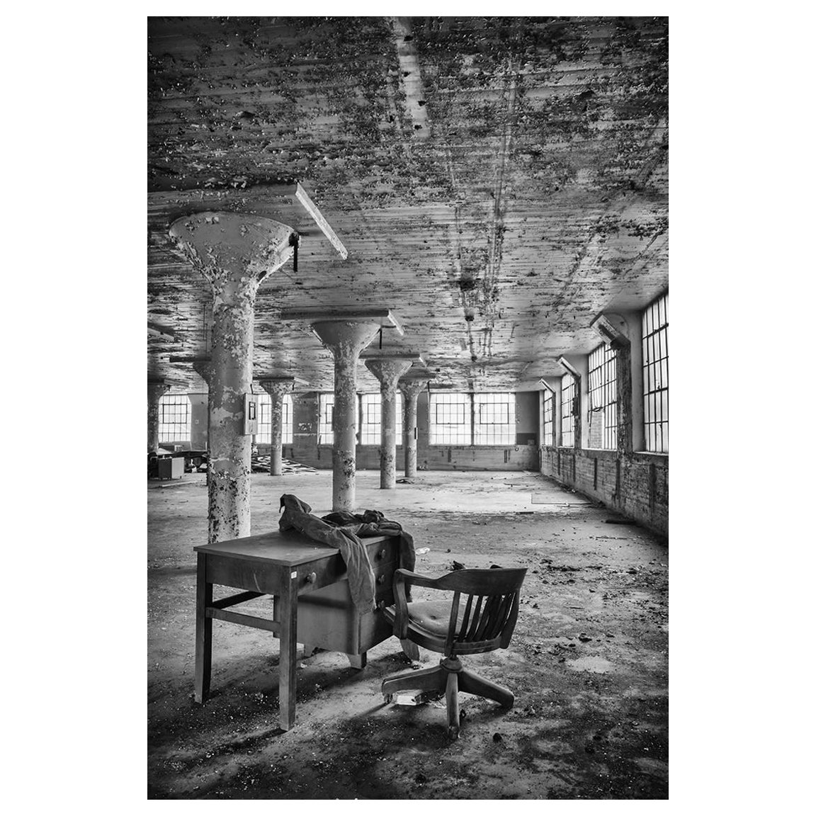 Rebecca Skinner Black and White Photograph - "Workspace", black and white, abandoned, factory, desk, office, photograph