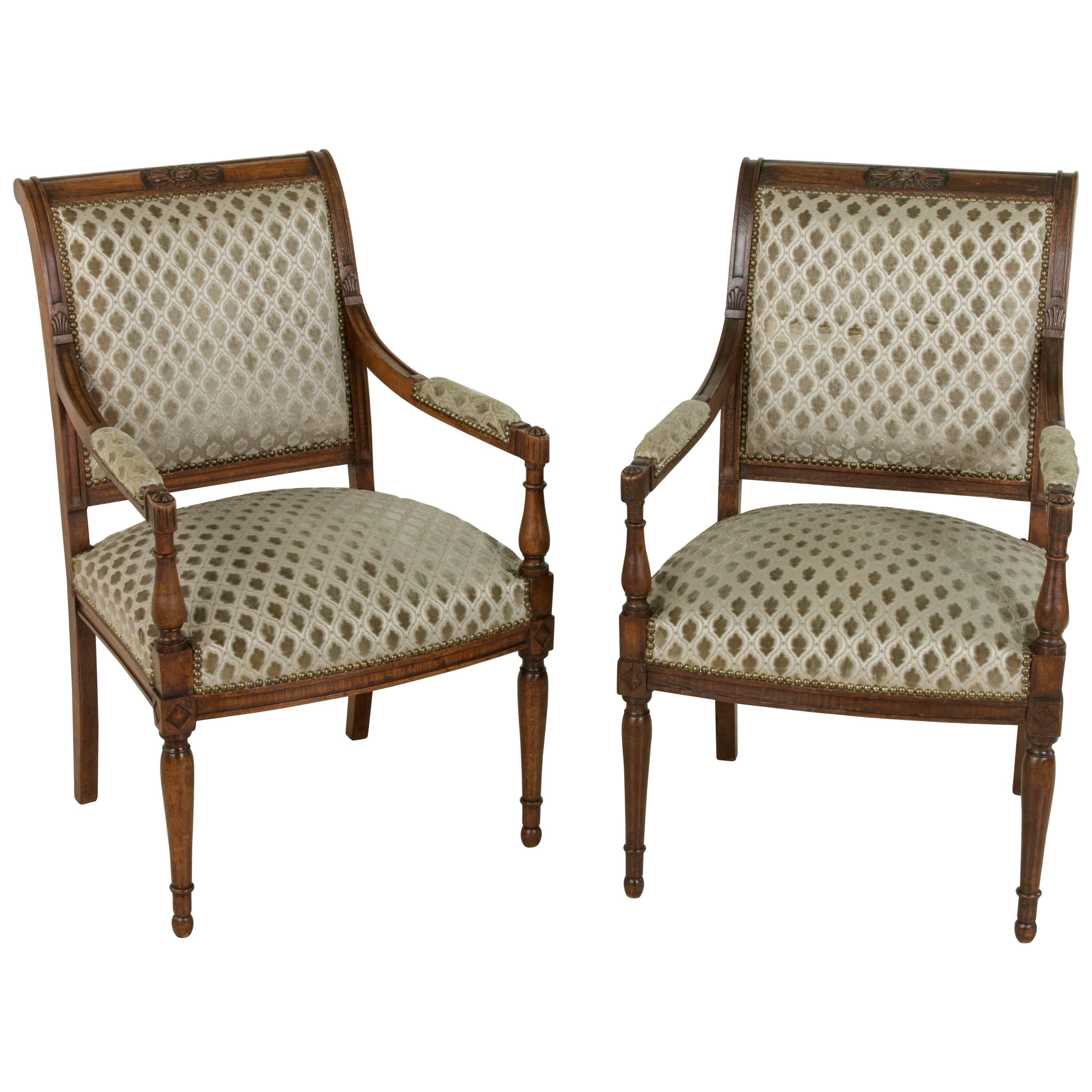 Pair of French Directoire Period Hand-Carved Walnut Armchairs, circa 1800