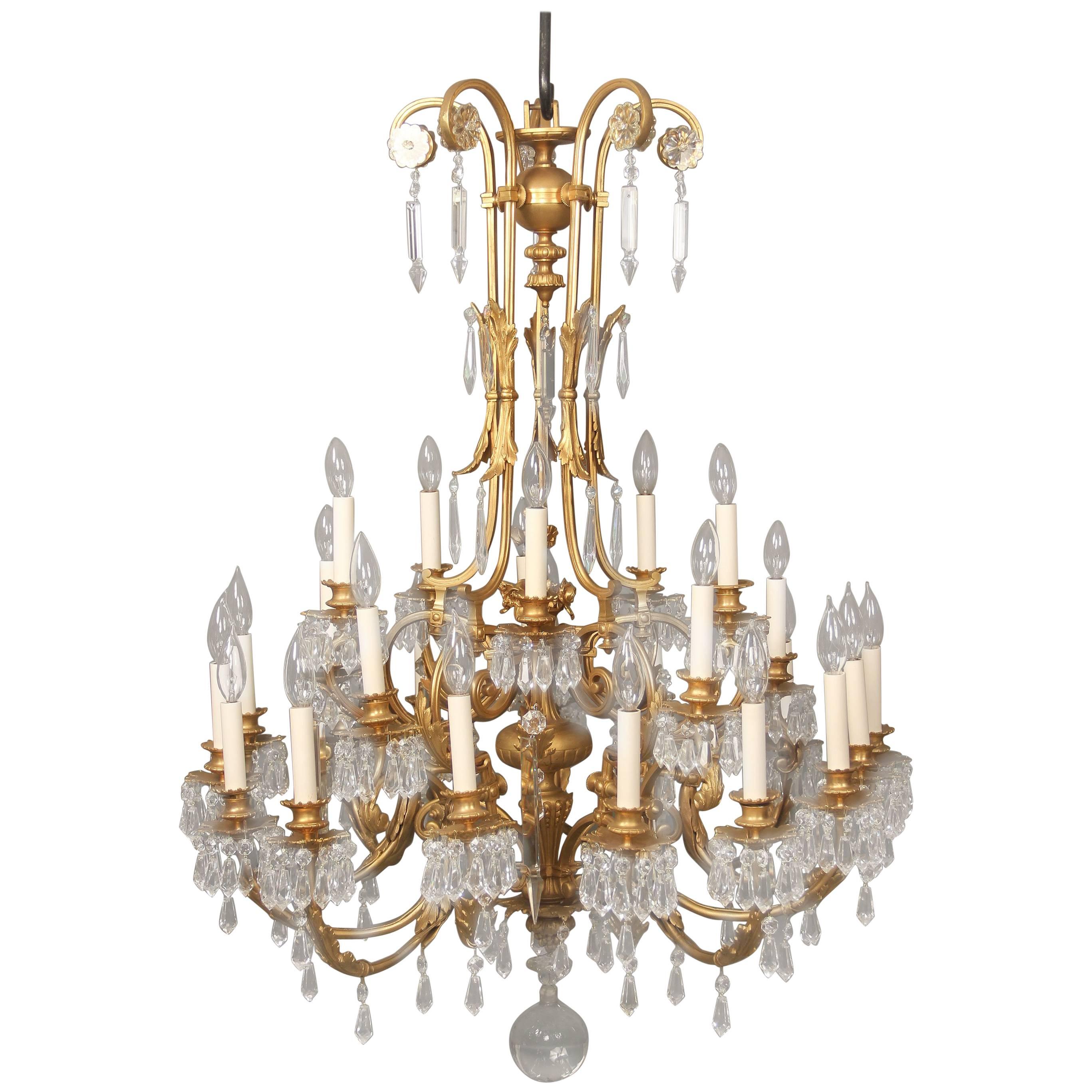 Early 20th Century Gilt Bronze and Drop Crystal Twenty Five Light Chandelier For Sale