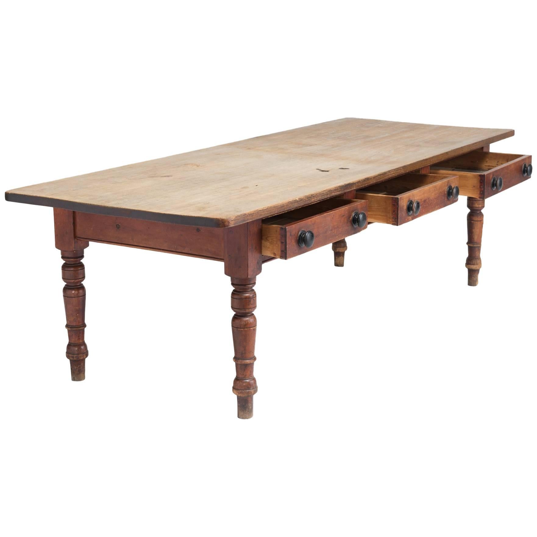 Farmhouse Table, England, circa 1940

Beautifully patinated table top on a base that includes three large drawers and turned legs.