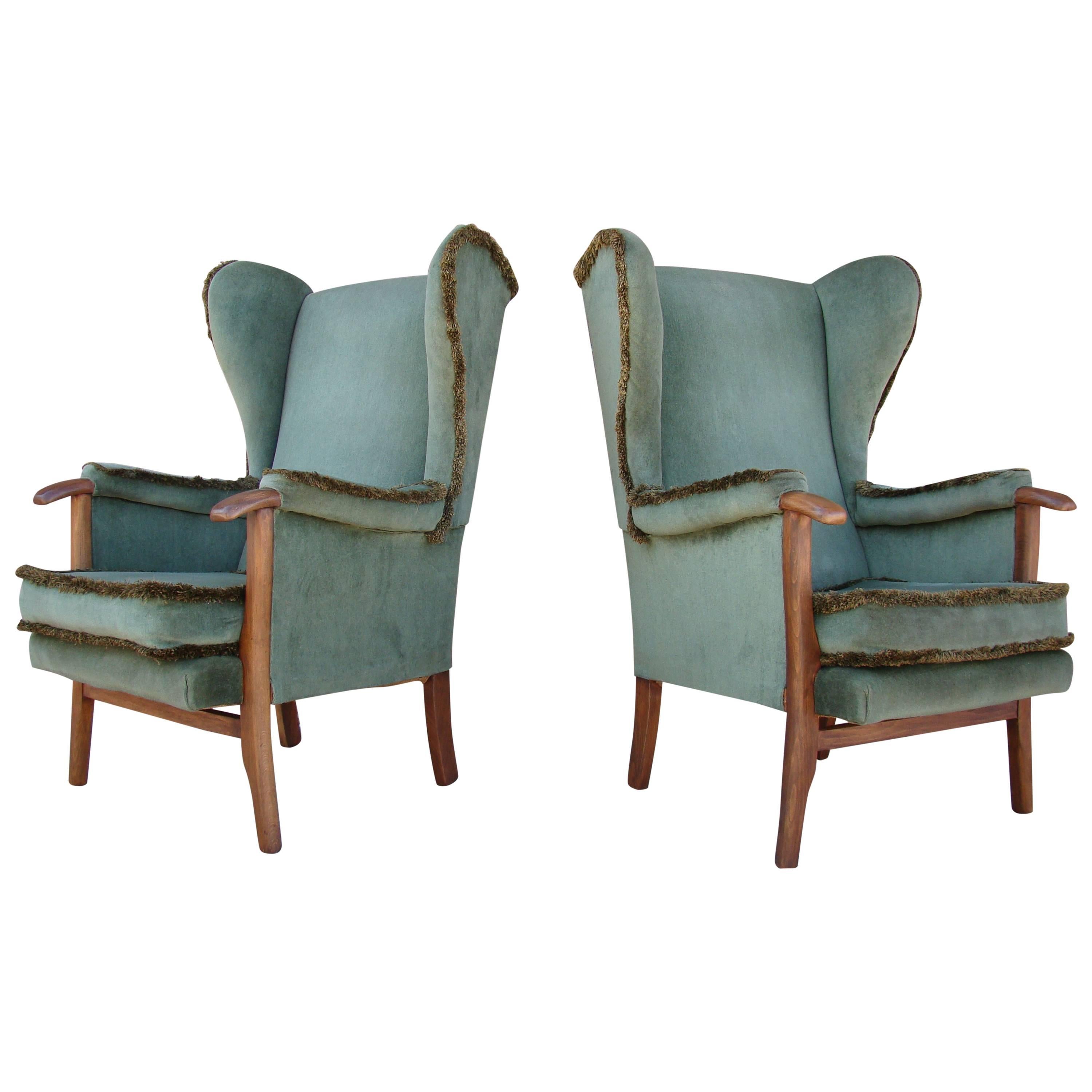 Fine Pair of Vintage Scandinavian Wingback Chairs with Exposed Walnut Detail For Sale