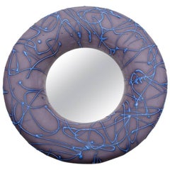 Ceramic mirror by Mia Jensen with blue and purple glaze decoration