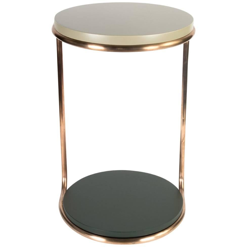 The 'Django' side table design was inspired by Mid-Century Modern aesthetic of graceful simplicity. The solid metal frame is shown in a bronze patina honed finish. The painted finishes shown are matte vintage green on top and matte Black on bottom