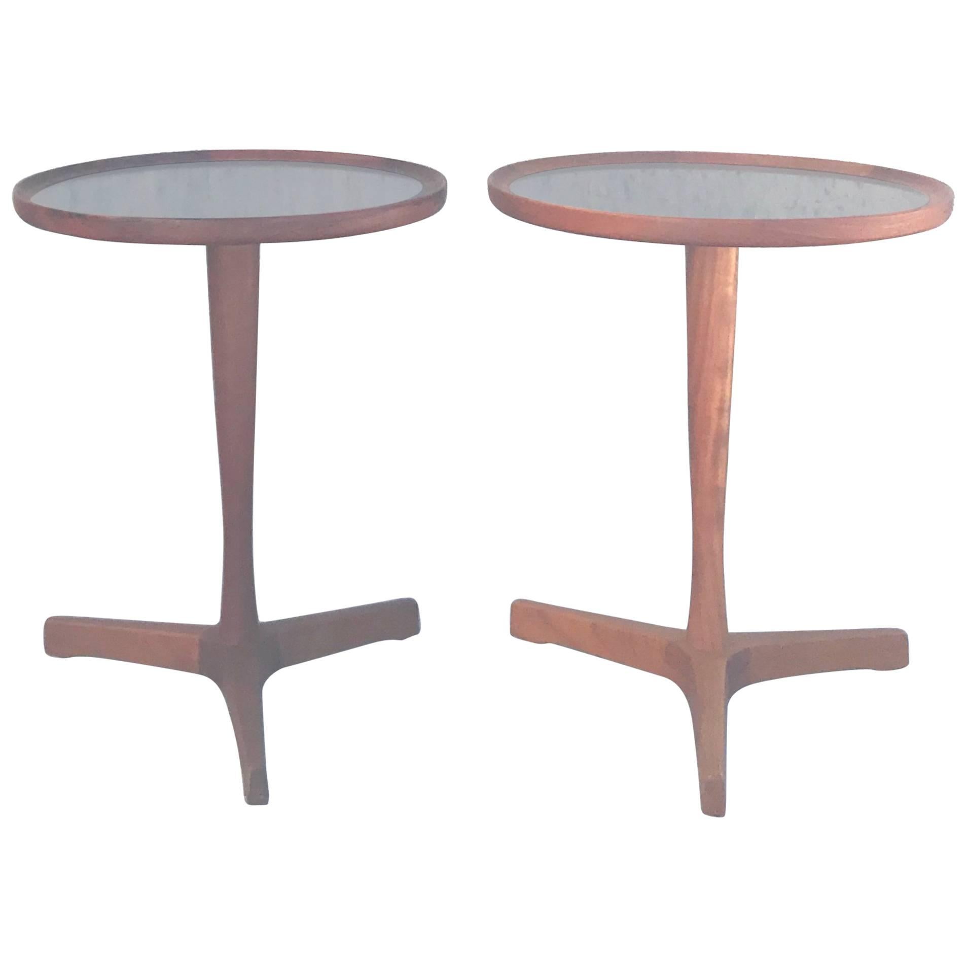 Chic pair of 1960s Danish Modern drinks tables designed by Hans Andersen, constructed of teak wood with black laminate inset tops.