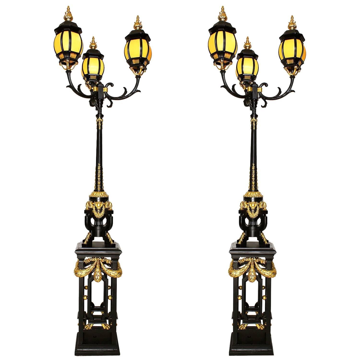 Pair French 19th-20th Century Neoclassical Style Iron and Parcel-Gilt Torcheres  For Sale