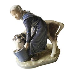 Royal Copenhagen Figurine Girl with Calf #779