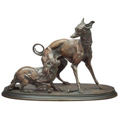 Grupo de bronce de un Whippet y perros pequineses, hacia 1880