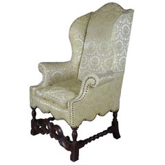 Antique English Edwardian Carved Mahogany Upholstered Wingback Chair, circa 1910