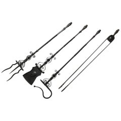 Important Set of Four Bronze and Wrought Iron Firetools