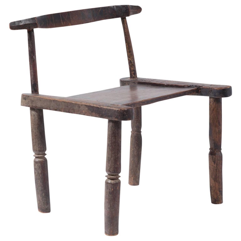West African Carved Wood Chair For Sale at 1stDibs