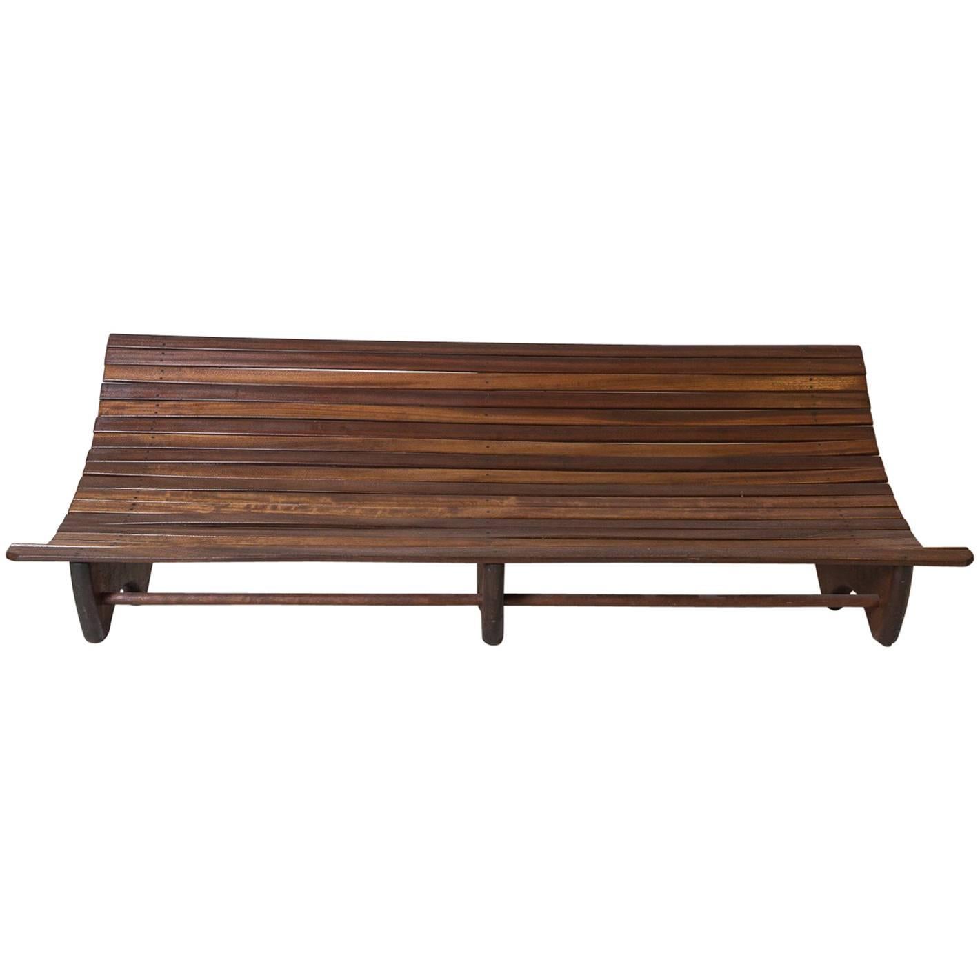 Wood Stained Brazilian Curved Slatted Bench with Three Legs