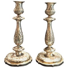 A Pair of Neo-Baroque Silver Repoussé Candlesticks, Russia, circa 1850s
