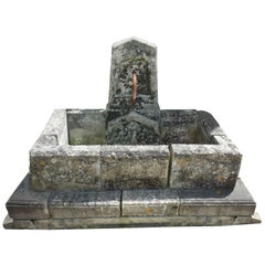 19th Century Provencal Style Stone Wall Fountain with Wrought Iron Water Spout