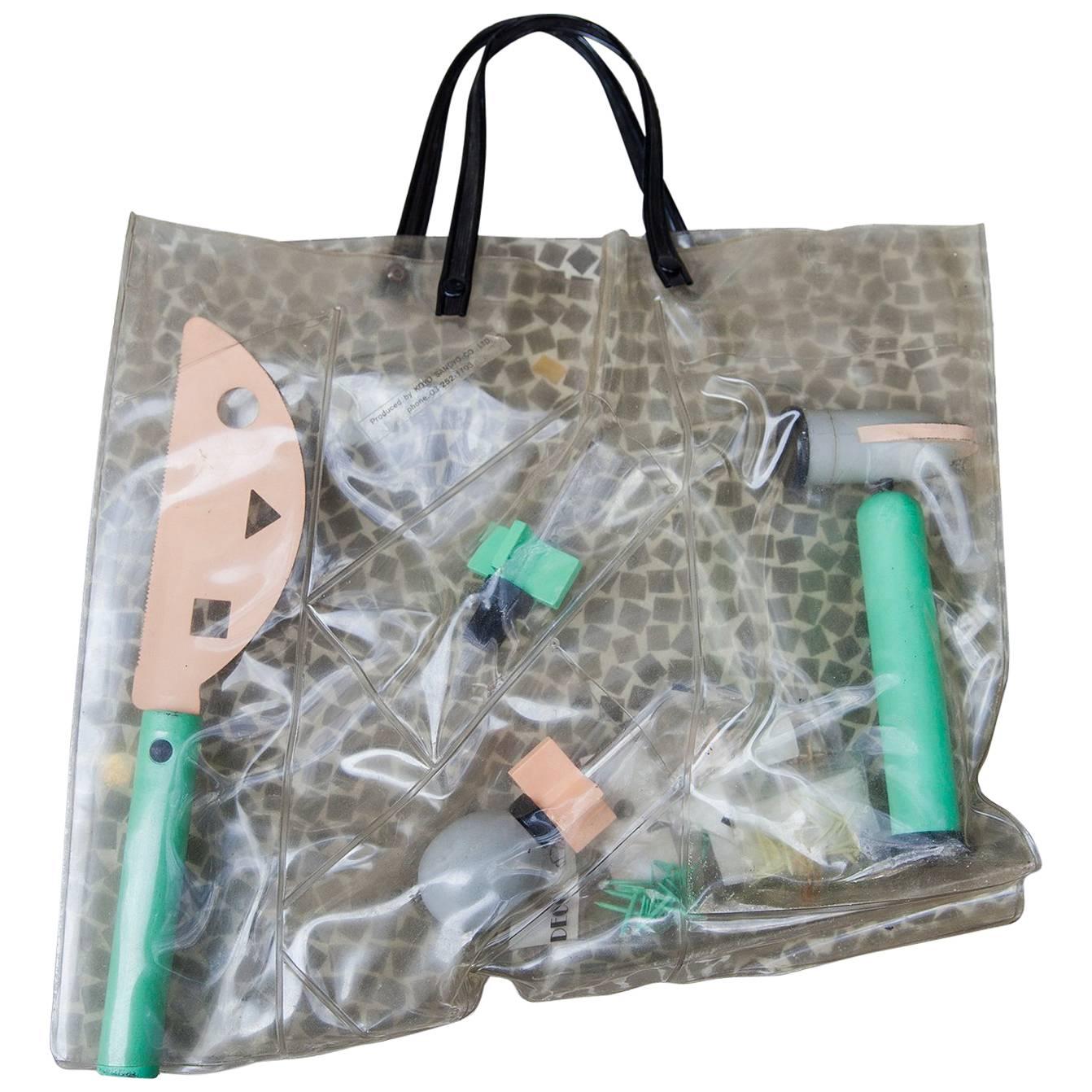 Rare tool kit designed by Koyo Sangyo, Japan, 1980s.
This complete set represents the 'Memphis' period and includes: a handsaws, a Hammer, two screwdrivers and five packages of nails all in the original plastic bag.
The typical soft colors used are