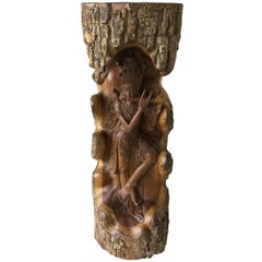 Hand-carved wooden statue with Lord Krishna from a piece of a tree