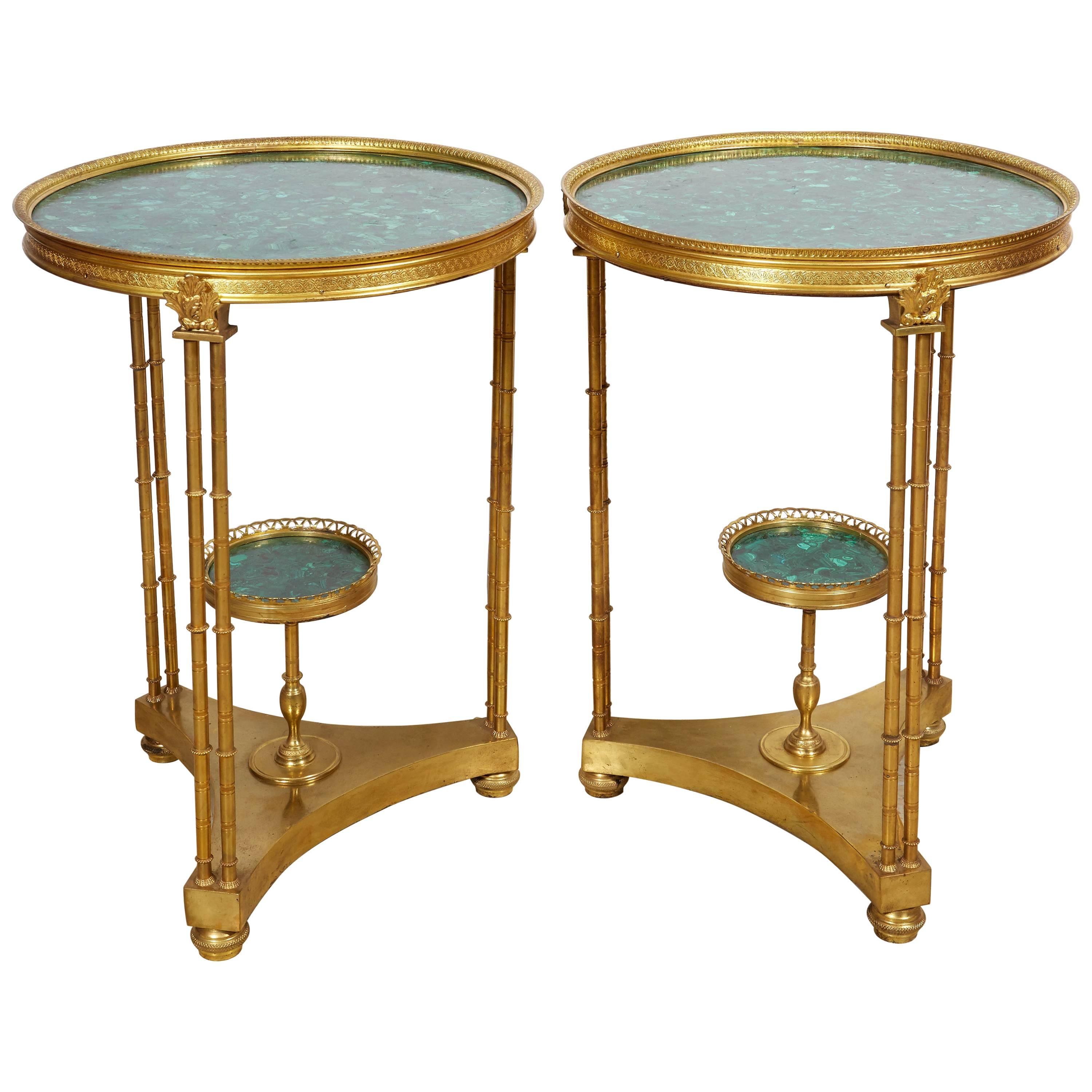 A pair of French Louis XVI style gilt bronze and malachite gueridon tables,
20th century.

Very fancy and decorative pair of side / end tables. 

Will go well in an room!

Measures: 27