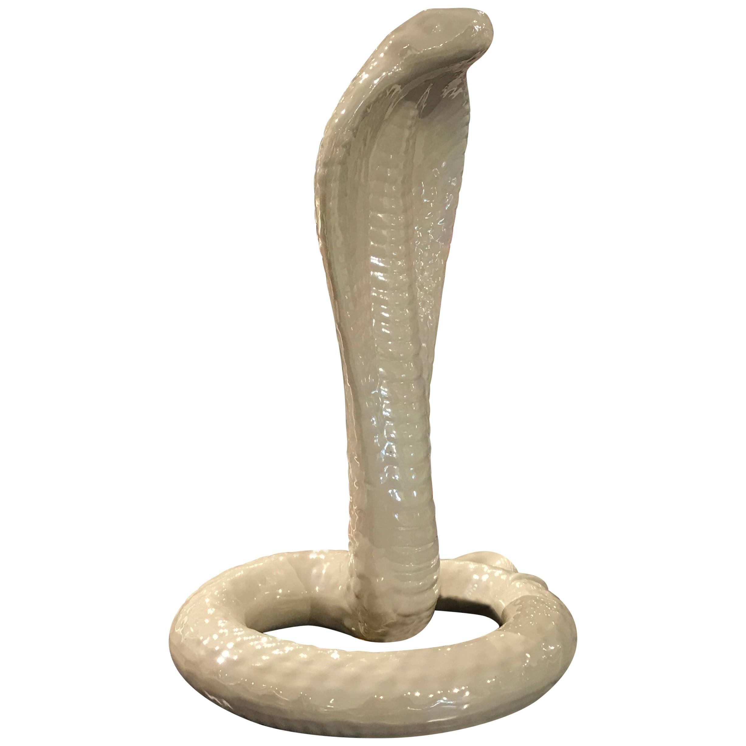 Gorgeous and rare pearlescent white cobra snake table lamp by Tommaso Barbi. The pearlescent finish on the lamp gives it a nice glow which immediately draws the eye.