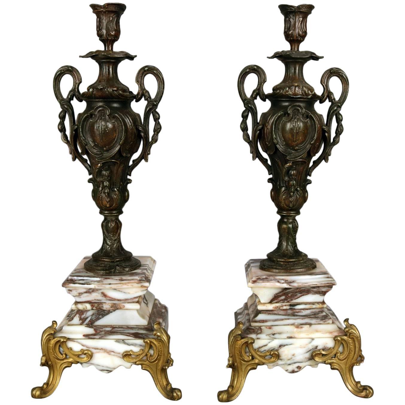 Pair of Classical Parcel-Gilt and Bronzed Urn Form Candlesticks on Marble Base