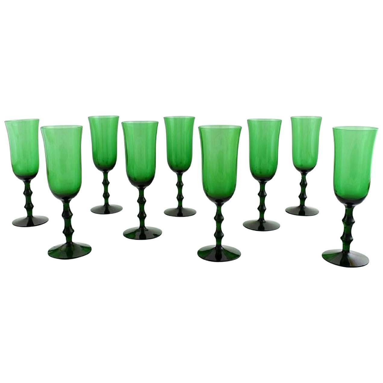 Simon Gate Orrefors, a Set of Nine Green Champagne Art Glasses
