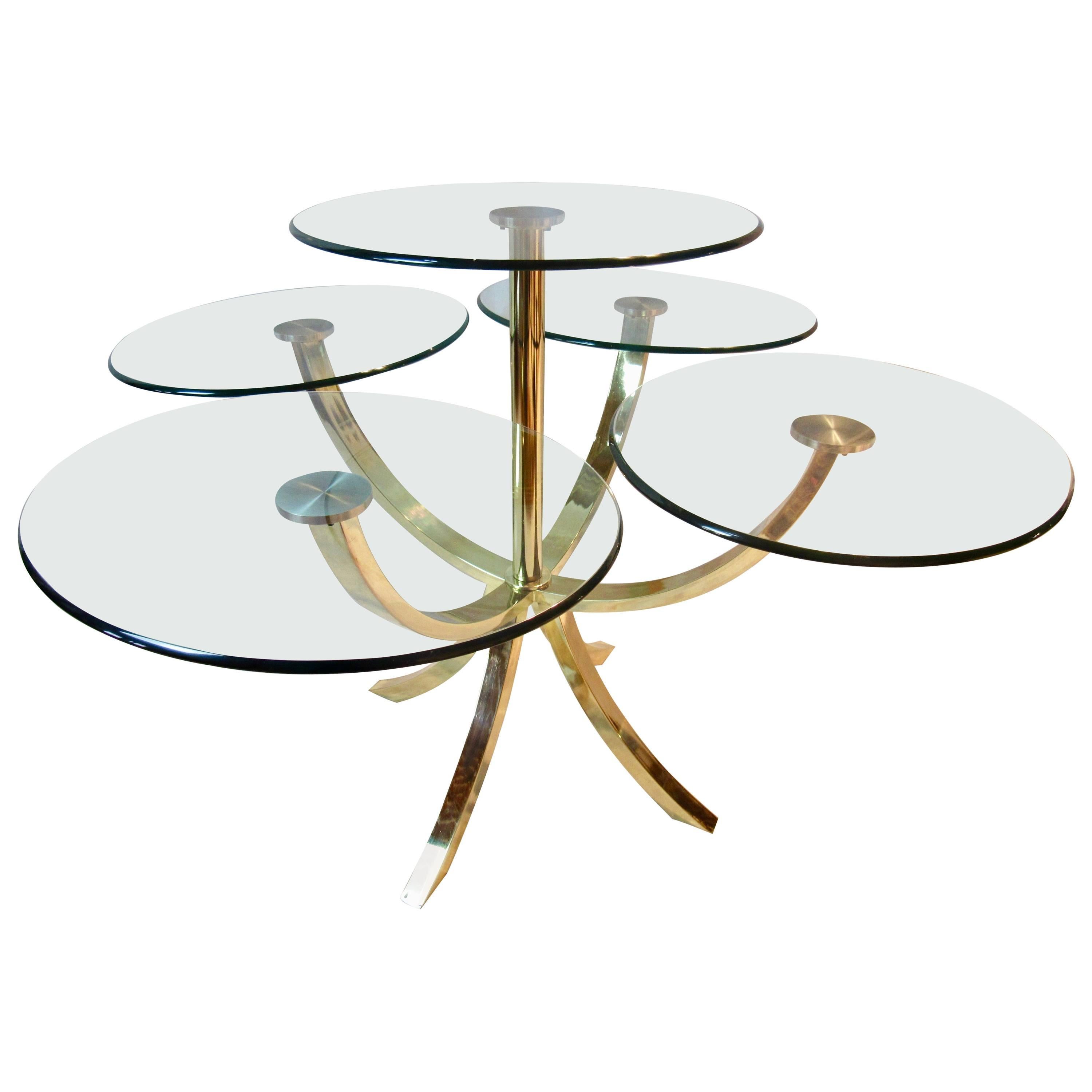 A Design Institute of America brass and glass dining table for four  1970s.
The D. I. A. 