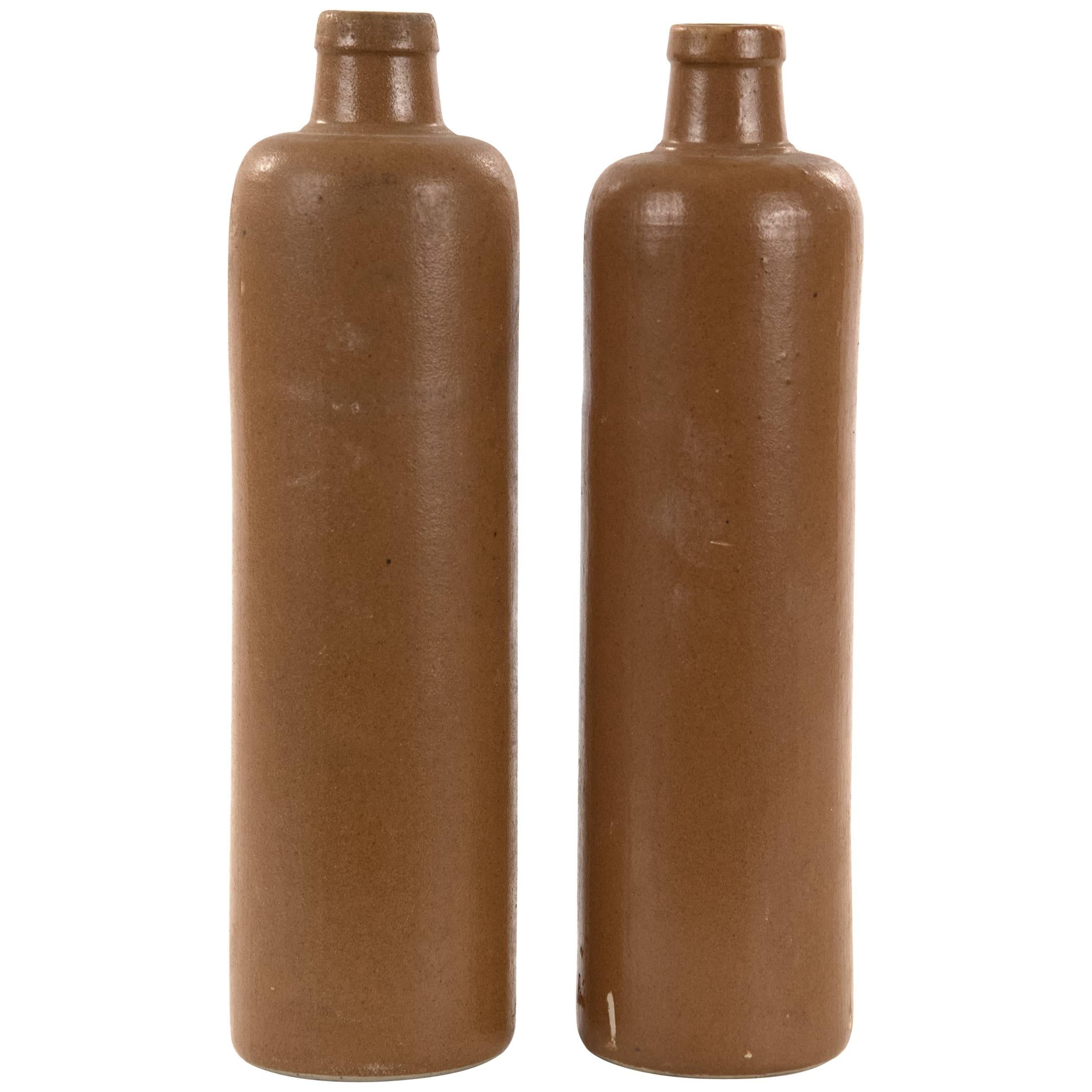 Pair of Elongated Brown Glazed Stoneware Bottles For Sale