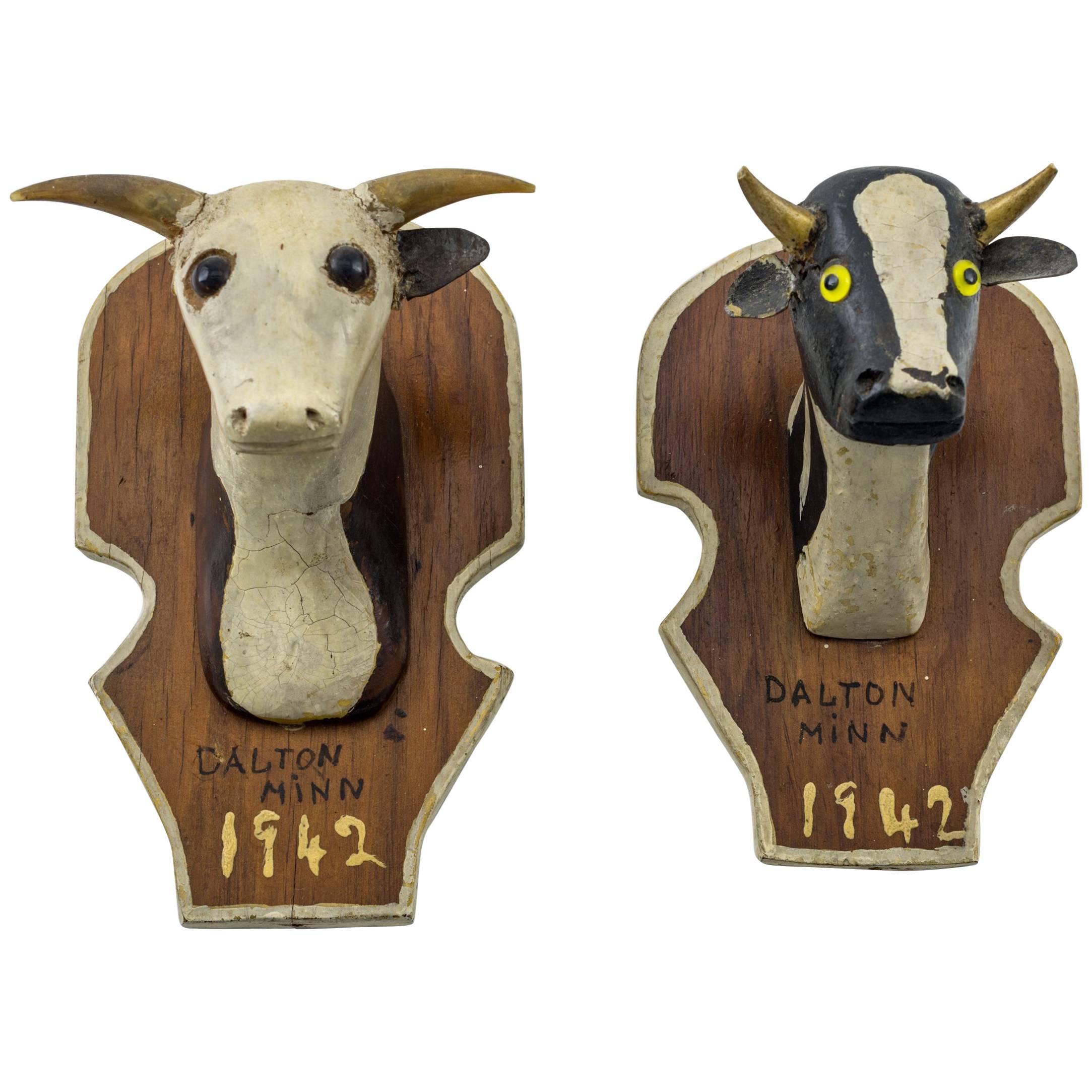 Pair of Miniature Carved Cow Heads, Dated 1942