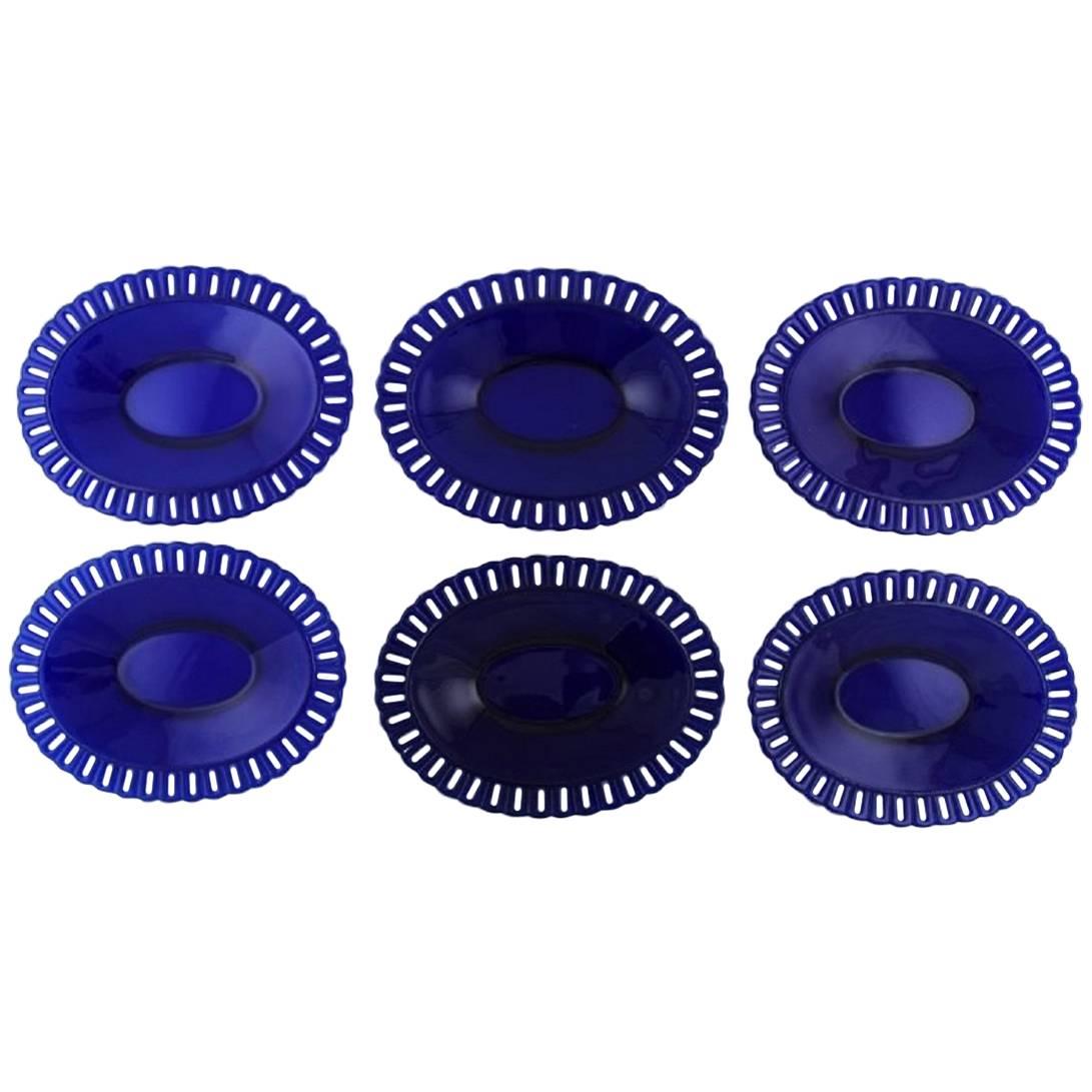 William Steberg for Gullaskuf, Seven Plates and Bowls in Dark Blue Art Glass