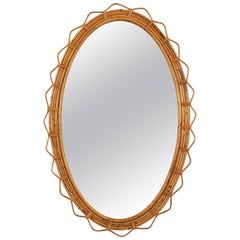 Large 1950s French Riviera Bamboo and Rattan Jagged Edge Oval Sunburst Mirror