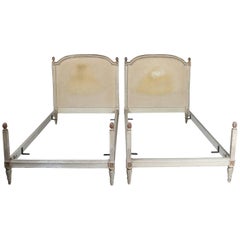 Pair of French Provincial Louis XVI Painted & Gilt Twin Bed Frames, circa 1930