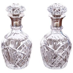 Pair of Antique Silver Topped Cut Glass Decanters